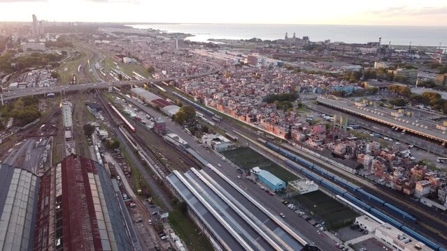 Aerial view showing Retiro Train Station and poor Villa 31 in Buenos Aires City at sunset