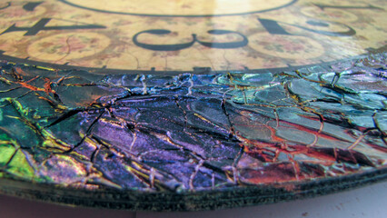 Close up of a colorful artistic clock placed on the floor