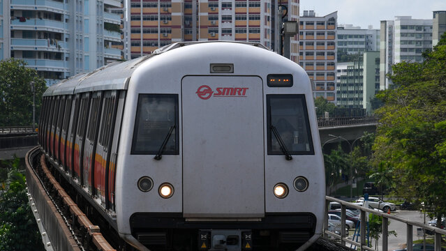 Singapore Mass Rapid Train (MRT) Approaching The Train Station