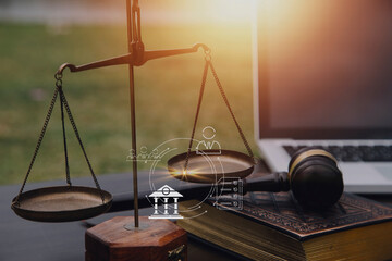 Justice and law concept.Male judge in a courtroom with the gavel, working with, computer and...