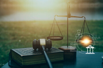 Justice and law concept.Male judge in a courtroom with the gavel, working with, computer and...