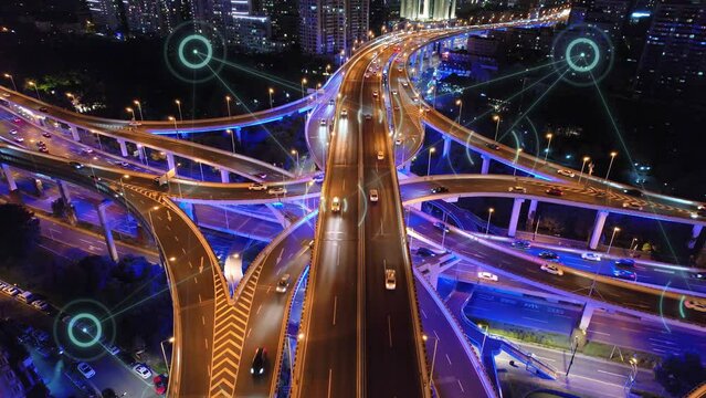 aerial view of smart city and smart traffic on road intersection in hangzhou at night