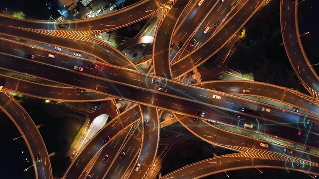 aerial view of smart city and smart traffic on road intersection in hangzhou at night