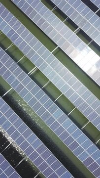 aerial view of solar power panels over water
