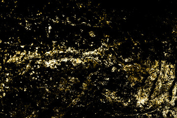 Dark grunge background of golden texture. Abstract for wallpaper or design.