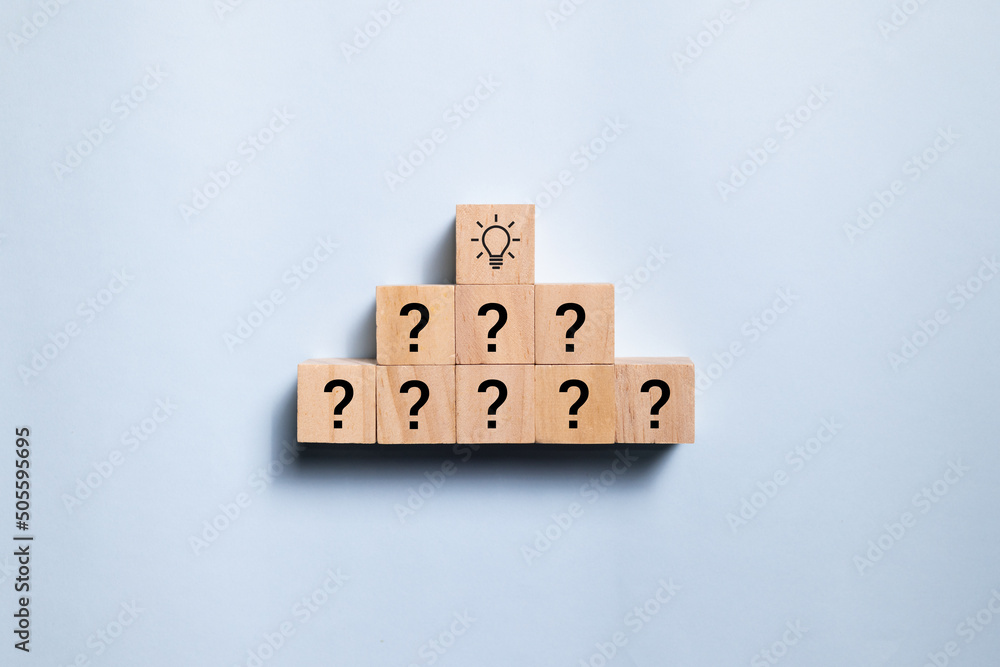 Poster top view wooden blocks with light bulb in pyramid. concept for creative and design solution.