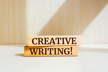 Wooden blocks with words 'Creative Writing'.