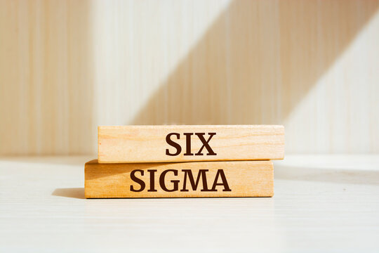 Wooden blocks with words 'six sigma'.