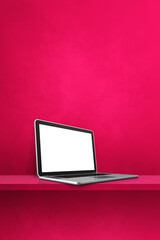 Laptop computer on pink shelf. Vertical background