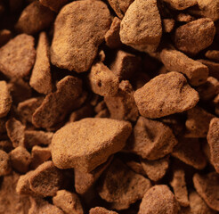 Instant coffee granules as background.
