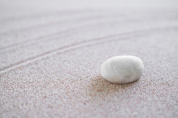 Fototapeta na wymiar Zen Garden Japanese pattern on white sand background. buddhism texture wave on desert nature at coast of shore. top view line abstract on beach with stone. Purity Meditation calm or lifestyles spa.