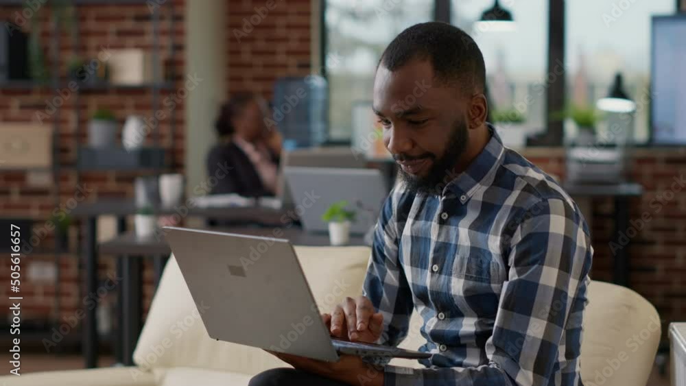 Poster african american worker analyzing financial report on laptop to create business strategy for company