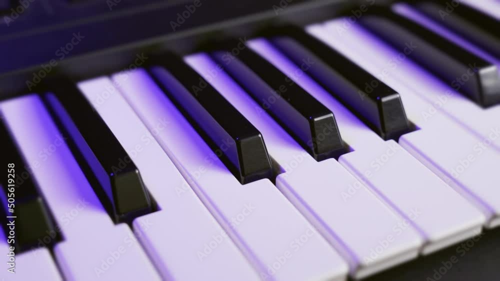Poster top view of the keys of a synthesizer keyboard, moving.