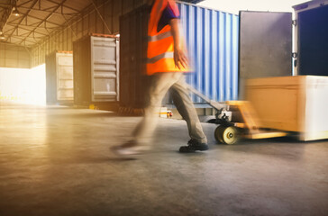 Motion Blur of Workers Unloading Cargo Pallets to The Cargo Container Trucks. Loading Dock. Shipping Warehouse. Delivery. Shipment Goods. Supply Chain. Warehouse Logistics Cargo Transport.	
 - obrazy, fototapety, plakaty
