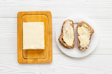 Slices of toast bread with butter. Breakfast with sandwiches - obrazy, fototapety, plakaty