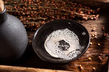 chinese liquor or baijiu in glass cup on table