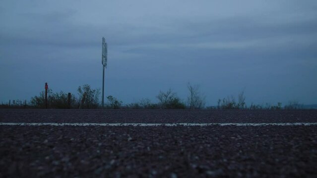 Car Passes on Desert Highway at Blue Hour 4K Left to Right Dolly