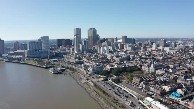 Aerial wide panning shot of New Orleans along the Mississippi River. 4K