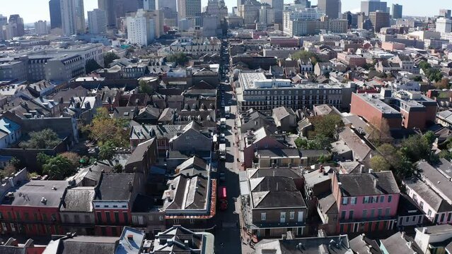 Aerial descending and tilting up shot of Bourbon Street in the French Quarter of New Orleans during the day. 4K