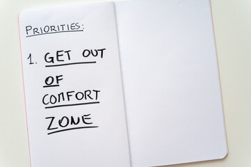 Diary page with text "priorities: get out of comfort zone". Lifestyle change
