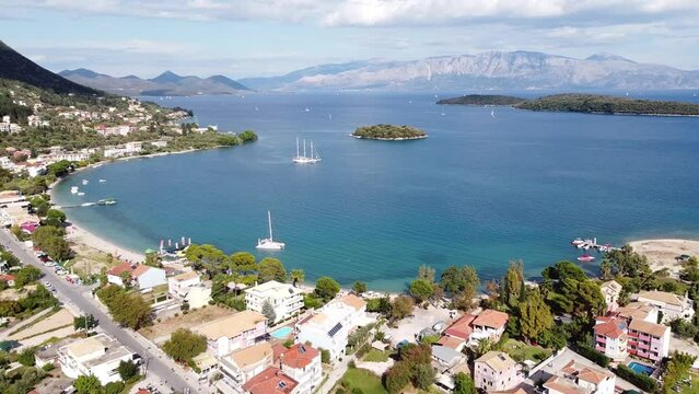 Nidri Bay, Boats and Small Madouri Island at Lefkada, Greece - Aerial Forward