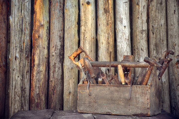 Old tool box on table on wood background