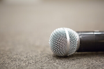 Selective focus of Microphone on stage floor background