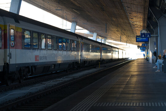 Train arriving at Zürich main station on a beautiful sunny spring morning at City of Zürich. Photo taken March 23, 2022, Zurich, Switzerland.