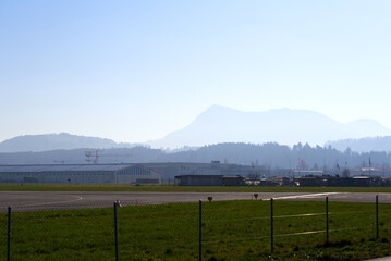 Panoramic view of Swiss Alps with Mount Rigi seen from City of Emmen on a sunny spring day. Photo taken March 23rd, 2022, Emmen, Switzerland.