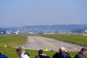 Spectators waiting for demonstration flight of American fighter jet Lockheed Martin F-35 at Swiss Air Force Air Base Emmen. Photo taken March 23rd, 2022, Emmen, Switzerland.