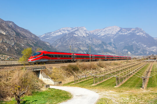 Frecciarossa FS ETR 1000 high-speed train of Trenitalia on Brenner Railway near Avio in Italy