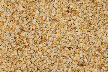Closeup image of oats cereal background. Vegetarian healthy lifestyle. Natural food texture