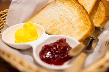 Bread toast with butter and strawberry jam