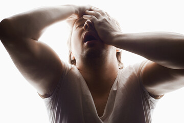 Screaming Man in studio isolated white background. Emotion boy