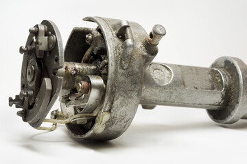 distributor of mechanical (conventional) ignition system close-up. contact breaker, rotor arm,...