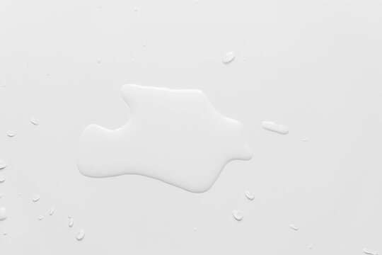 .Water spilled on a white table - Image
