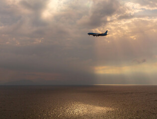Fototapeta na wymiar Greece. Corfu. A passenger plane flies for a landing near the city of Kerkyra.