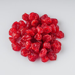 dried cherry berry on a white acrylic background