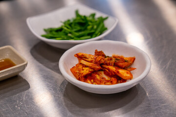 A closeup photo of a dish of Kimchi, taken at a local restaurant