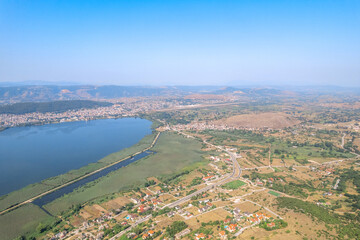 Lake, village, townhomes, forest in the mountain. Drone view, aerial view, top view