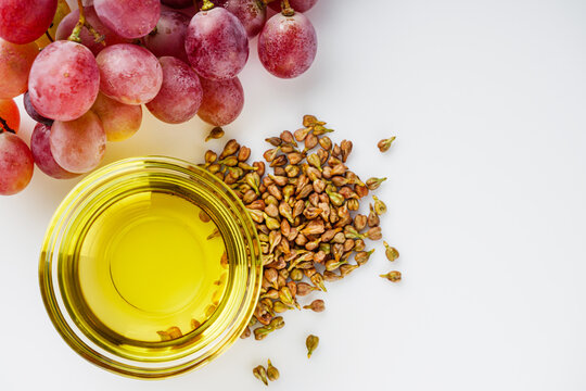grape seed essential oil on a white background