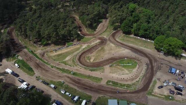Motorcycles on motocross terrain in the forest in Halle, The Netherlands