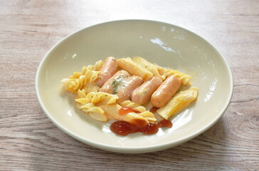 bake fusilli and penne with pork sausage chees dressing seaweed on plate
