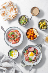 Healthy Turkish breakfast spread in the bright morning, white background - 505684218