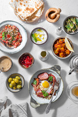 Healthy Turkish breakfast spread in the bright morning, white background