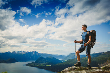 Traveller with backpack and mountain panorama