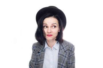 positive woman in office suit and top hat, white studio background