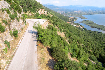 Fototapeta na wymiar Meandering serpentine road in the mountain. Aerial view. Copter, drone view