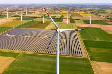 Aerial view of sustainable energy generation in Germany by solar panels and wind turbines