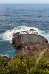 Natural pool on rocky shore